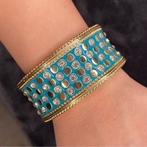 Golden turquoise cuff bracelet with diamonds.